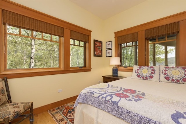 526 Chief Joseph, Big Sky, MT 59716 - bedroom with multiple windows and wood finished floors