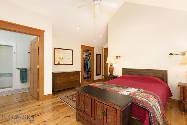 526 Chief Joseph, Big Sky, MT 59716 - bedroom featuring lofted ceiling, light wood-style floors, a walk in closet, and a ceiling fan