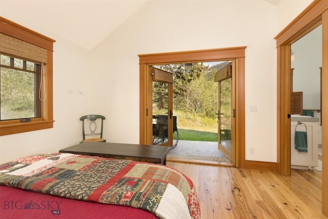 526 Chief Joseph, Big Sky, MT 59716 - bedroom with wood finished floors, access to exterior, and high vaulted ceiling