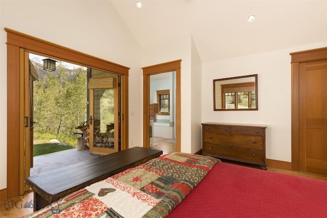 526 Chief Joseph, Big Sky, MT 59716 - bedroom featuring access to exterior, multiple windows, vaulted ceiling, recessed lighting, and connected bathroom