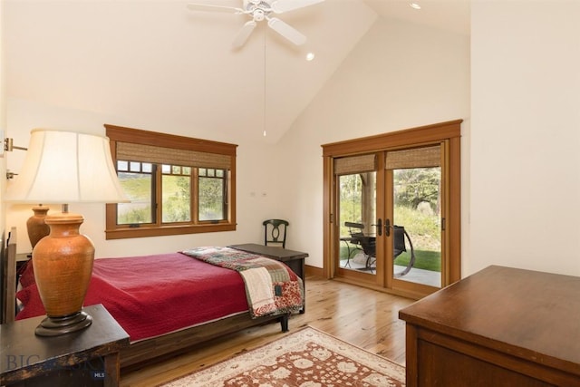 526 Chief Joseph, Big Sky, MT 59716 - bedroom with french doors, light wood-style floors, high vaulted ceiling, access to exterior, and multiple windows