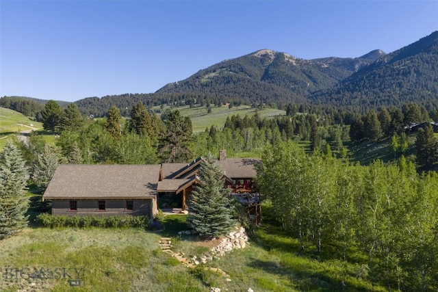 526 Chief Joseph, Big Sky, MT 59716 - view of mountain backdrop featuring a heavily wooded area