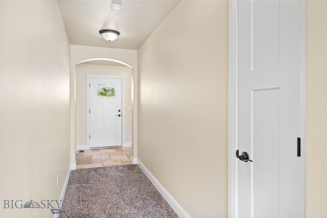 1705 Ingomar Blvd, Belgrade, MT 59714 - doorway featuring arched walkways and carpet flooring