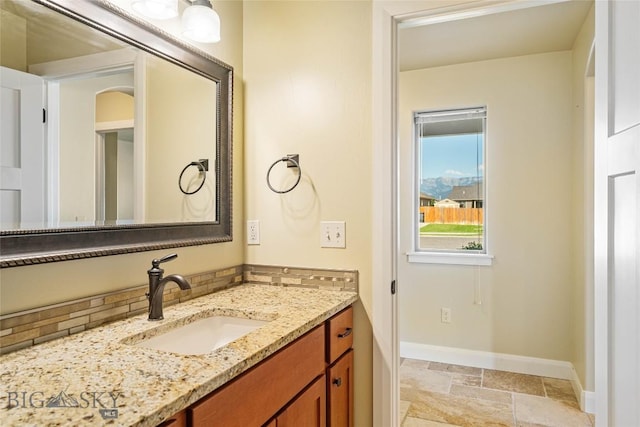 1705 Ingomar Blvd, Belgrade, MT 59714 - bathroom featuring vanity and stone tile flooring