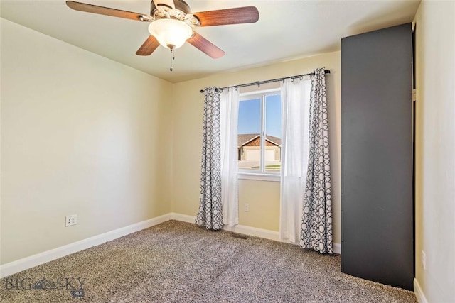 1705 Ingomar Blvd, Belgrade, MT 59714 - spare room featuring carpet and a ceiling fan