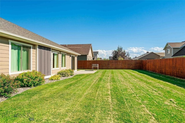 1705 Ingomar Blvd, Belgrade, MT 59714 - fenced backyard with a patio