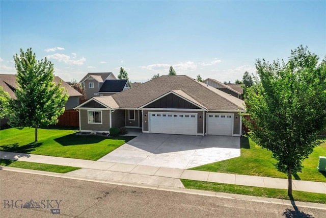 1705 Ingomar Blvd, Belgrade, MT 59714 - view of front of property featuring a garage, board and batten siding, and concrete driveway