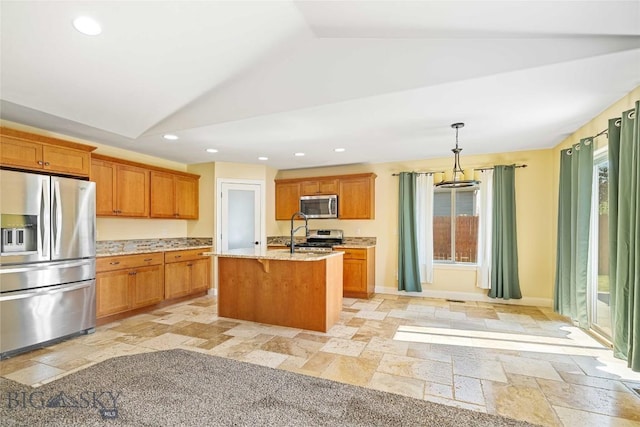 1705 Ingomar Blvd, Belgrade, MT 59714 - kitchen featuring appliances with stainless steel finishes, lofted ceiling, stone tile floors, a kitchen bar, and recessed lighting