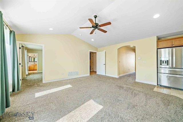 1705 Ingomar Blvd, Belgrade, MT 59714 - unfurnished living room featuring arched walkways, vaulted ceiling, light colored carpet, ceiling fan, and recessed lighting