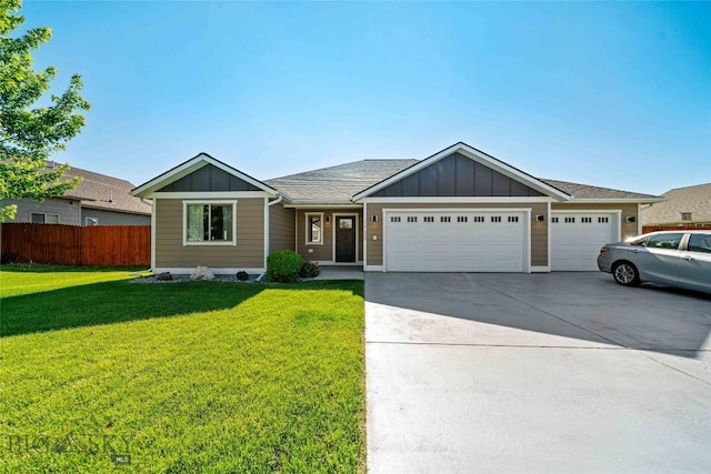 1705 Ingomar Blvd, Belgrade, MT 59714 - ranch-style house with board and batten siding, an attached garage, and concrete driveway