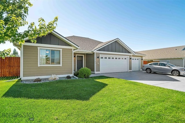 1705 Ingomar Blvd, Belgrade, MT 59714 - view of front facade featuring board and batten siding, a garage, concrete driveway, and roof with shingles