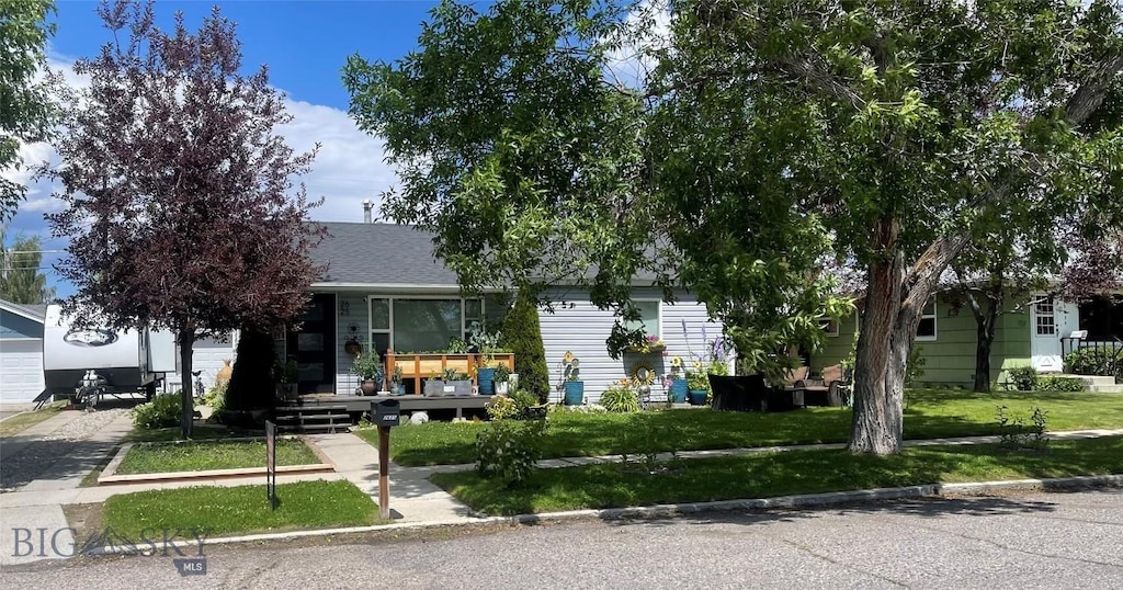 2625 St Ann St, Butte, MT 59701 - view of property hidden behind natural elements featuring a front lawn
