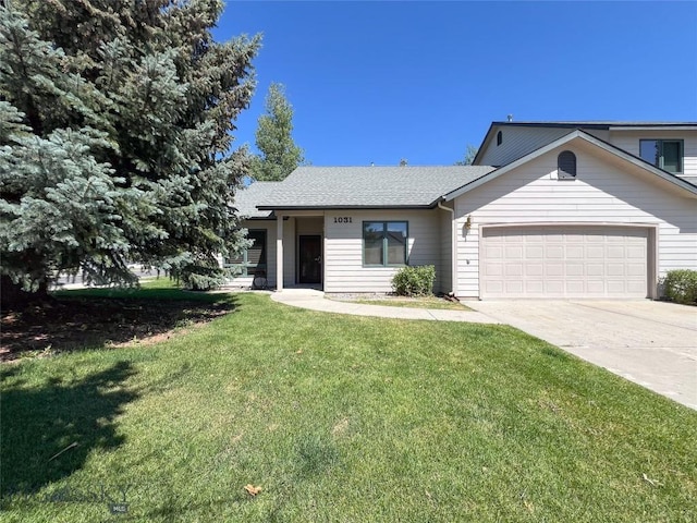 1031 Boylan, Bozeman, MT 59715 - view of front of home featuring an attached garage, a front lawn, driveway, and a shingled roof