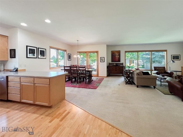 1031 Boylan, Bozeman, MT 59715 - kitchen featuring open floor plan, light wood finished floors, light countertops, recessed lighting, and pendant lighting