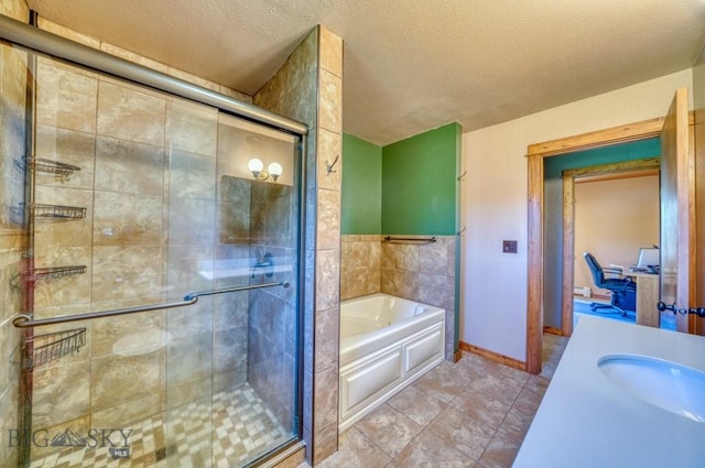 8799 Huffman Ln, Bozeman, MT 59715 - bathroom featuring a garden tub, a stall shower, vanity, tile patterned flooring, and a textured ceiling