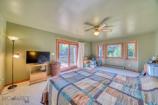 8799 Huffman Ln, Bozeman, MT 59715 - bedroom with a baseboard heating unit, access to outside, carpet floors, and a ceiling fan