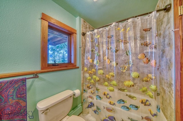 8799 Huffman Ln, Bozeman, MT 59715 - bathroom featuring a textured wall and a shower with curtain