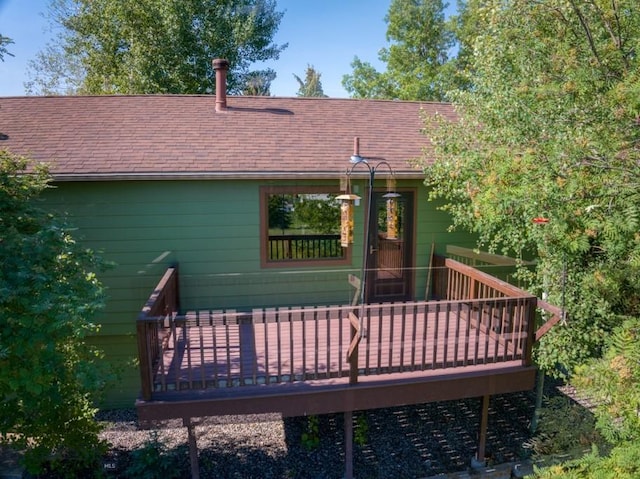8799 Huffman Ln, Bozeman, MT 59715 - rear view of property with a wooden deck and roof with shingles