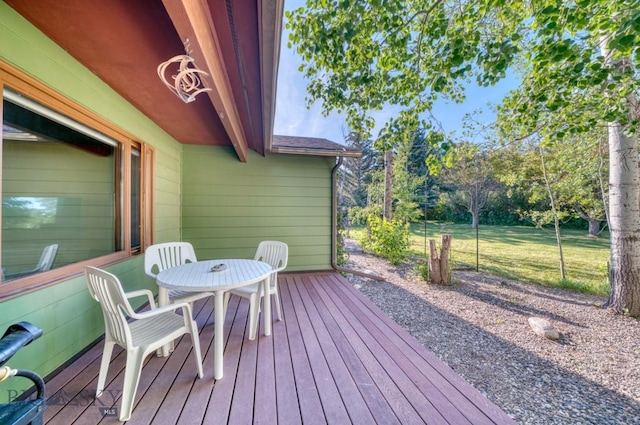8799 Huffman Ln, Bozeman, MT 59715 - deck with outdoor dining space and a yard