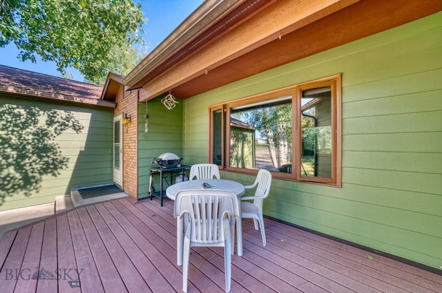 8799 Huffman Ln, Bozeman, MT 59715 - wooden terrace with outdoor dining space