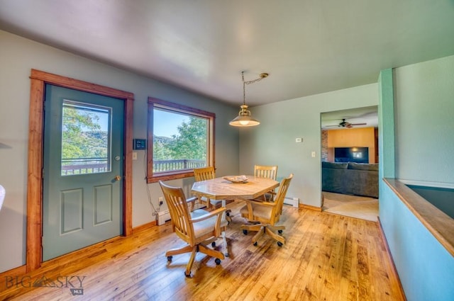8799 Huffman Ln, Bozeman, MT 59715 - dining room featuring light wood-type flooring and ceiling fan