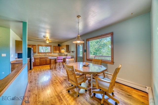 8799 Huffman Ln, Bozeman, MT 59715 - dining area featuring light wood-style floors and ceiling fan