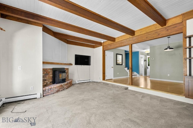 2020 S Rouse Unit 7, Bozeman, MT 59715 - unfurnished living room with beamed ceiling, carpet floors, baseboard heating, and a fireplace