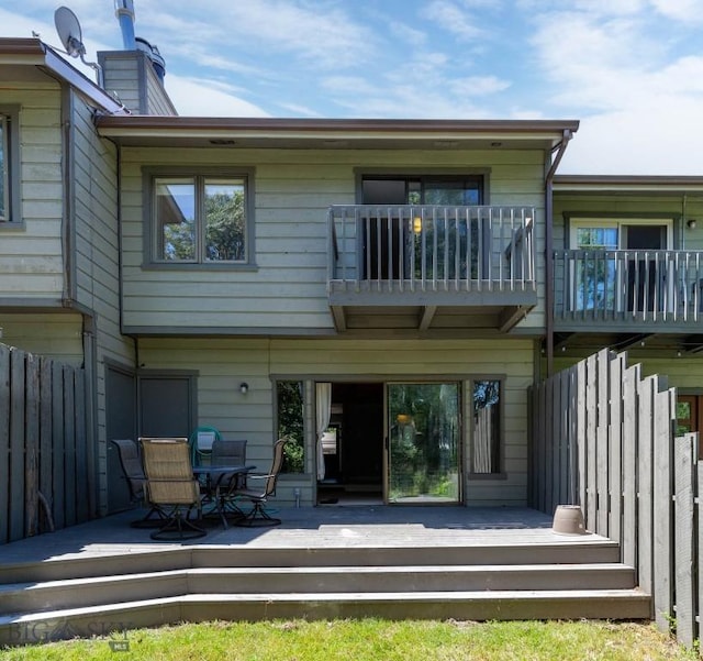 2020 S Rouse Unit 7, Bozeman, MT 59715 - rear view of house with a chimney, a balcony, and a deck