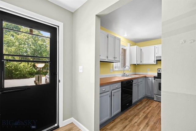 2020 S Rouse Unit 7, Bozeman, MT 59715 - kitchen featuring black dishwasher, gray cabinetry, stainless steel range with electric cooktop, light wood-style floors, and under cabinet range hood