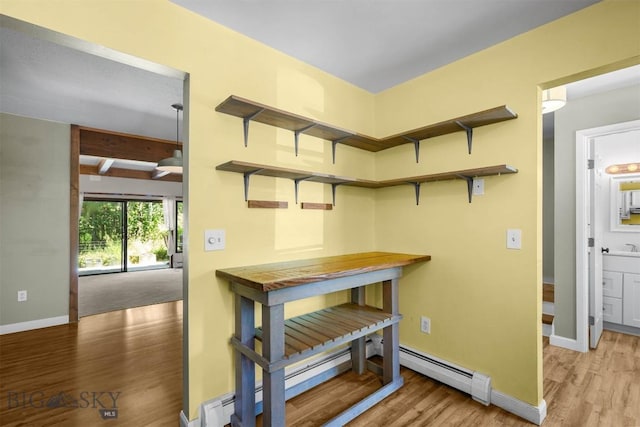 2020 S Rouse Unit 7, Bozeman, MT 59715 - hall with wood finished floors and a baseboard heating unit
