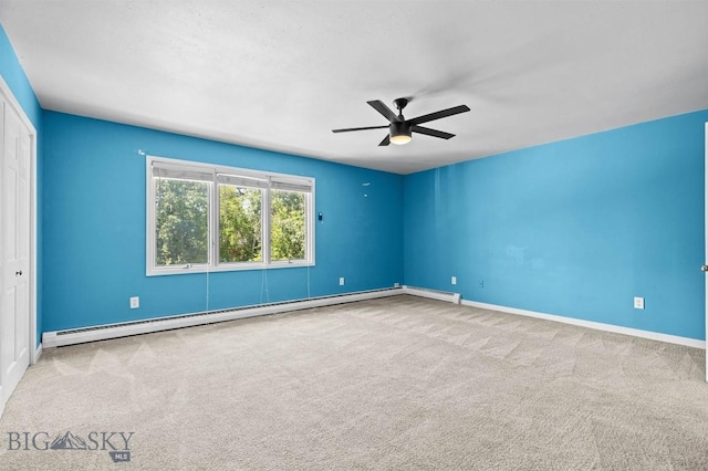 2020 S Rouse Unit 7, Bozeman, MT 59715 - carpeted empty room with baseboard heating and a ceiling fan