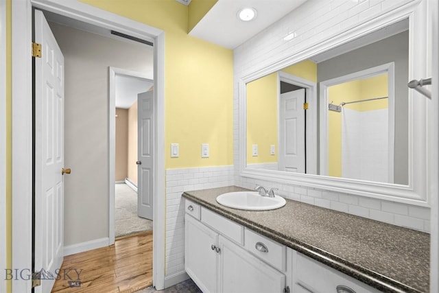 2020 S Rouse Unit 7, Bozeman, MT 59715 - full bathroom featuring vanity, wood finished floors, and a shower