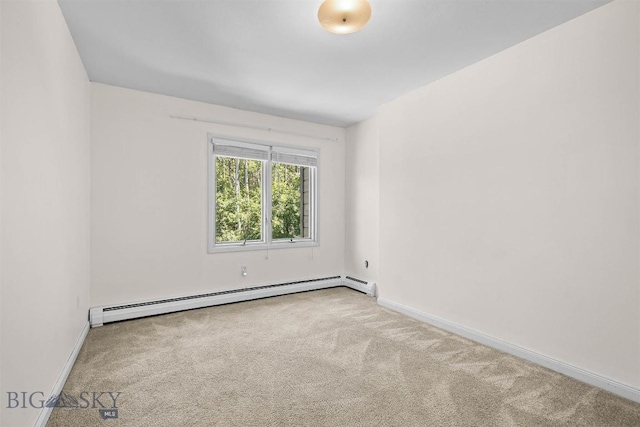 2020 S Rouse Unit 7, Bozeman, MT 59715 - unfurnished room featuring a baseboard heating unit and carpet