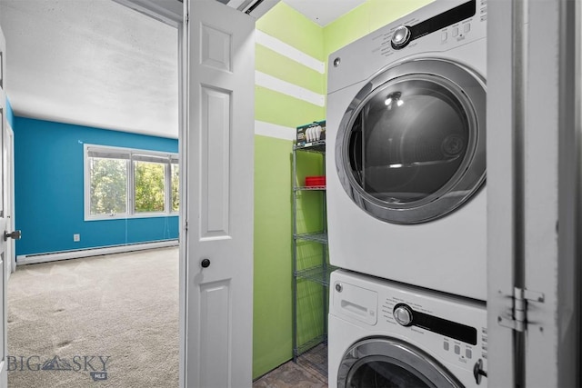 2020 S Rouse Unit 7, Bozeman, MT 59715 - laundry area with a baseboard heating unit, stacked washer and clothes dryer, and carpet floors