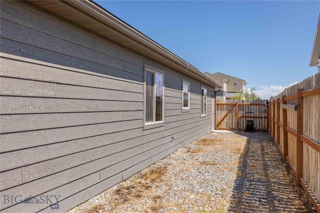 616 W Adams St, Three Forks, MT 59752 - view of side of home with a fenced backyard