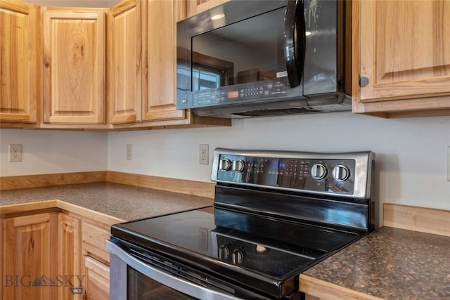 616 W Adams St, Three Forks, MT 59752 - kitchen featuring stainless steel electric stove, black microwave, dark countertops, and light brown cabinetry