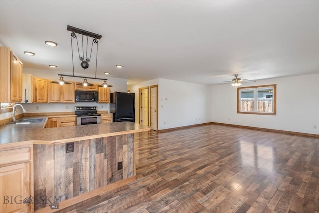 616 W Adams St, Three Forks, MT 59752 - kitchen with black appliances, ceiling fan, dark wood-style flooring, recessed lighting, and a peninsula