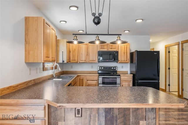 616 W Adams St, Three Forks, MT 59752 - kitchen with black appliances, light brown cabinetry, a peninsula, dark countertops, and pendant lighting