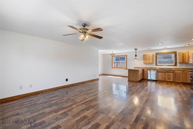 616 W Adams St, Three Forks, MT 59752 - unfurnished living room featuring plenty of natural light, a ceiling fan, and dark wood-style floors