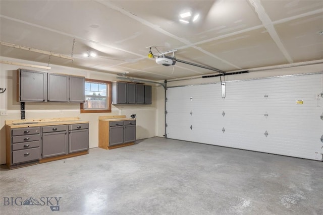 616 W Adams St, Three Forks, MT 59752 - garage with a garage door opener