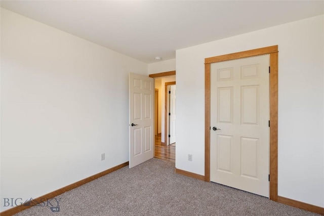 616 W Adams St, Three Forks, MT 59752 - unfurnished bedroom featuring baseboards and carpet floors