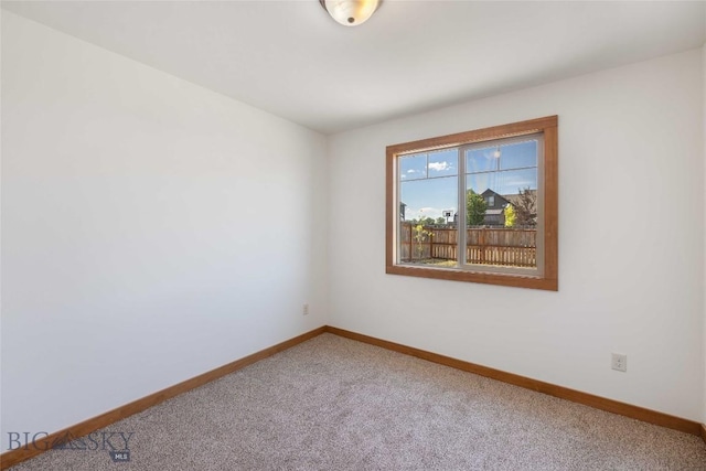 616 W Adams St, Three Forks, MT 59752 - carpeted empty room featuring baseboards