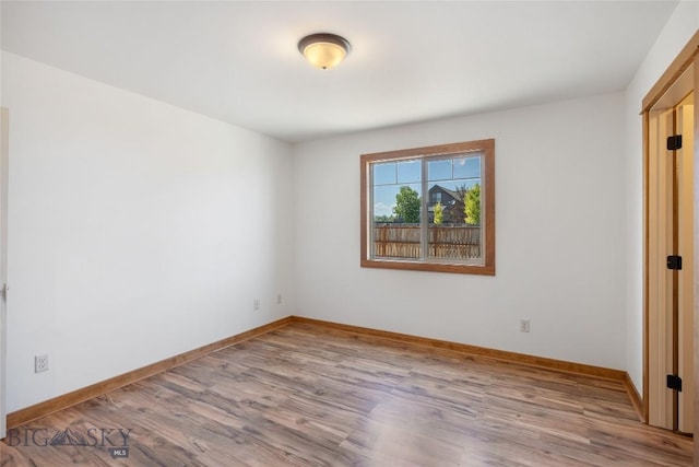 616 W Adams St, Three Forks, MT 59752 - unfurnished bedroom featuring wood finished floors and baseboards