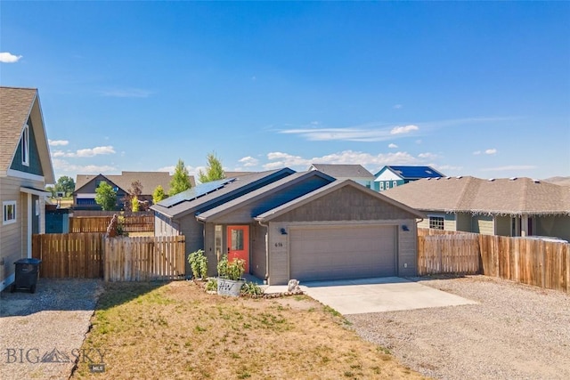616 W Adams St, Three Forks, MT 59752 - ranch-style house featuring concrete driveway, a garage, solar panels, and a residential view