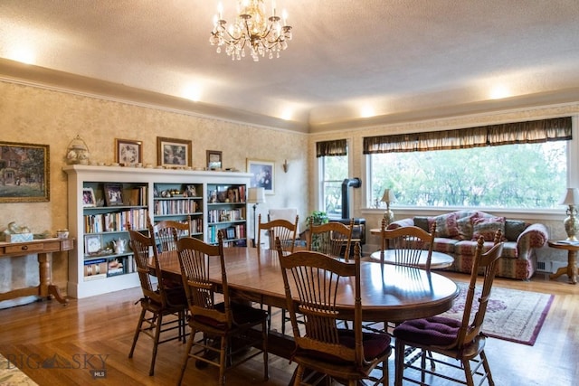 300 Holmes, Butte, MT 59701 - dining space with wood finished floors, a chandelier, and a textured ceiling