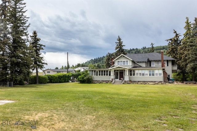 300 Holmes, Butte, MT 59701 - view of front of property featuring entry steps, a front lawn, and a chimney