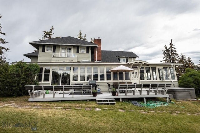 300 Holmes, Butte, MT 59701 - back of house featuring a sunroom, a balcony, a chimney, a wooden deck, and a yard