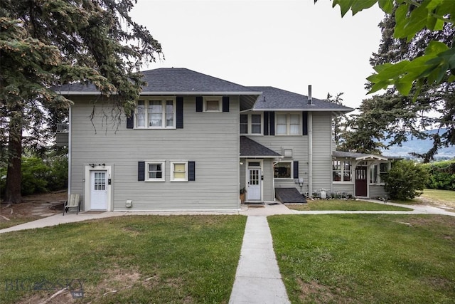 300 Holmes, Butte, MT 59701 - view of front of property with a front lawn, a shingled roof, and a sunroom