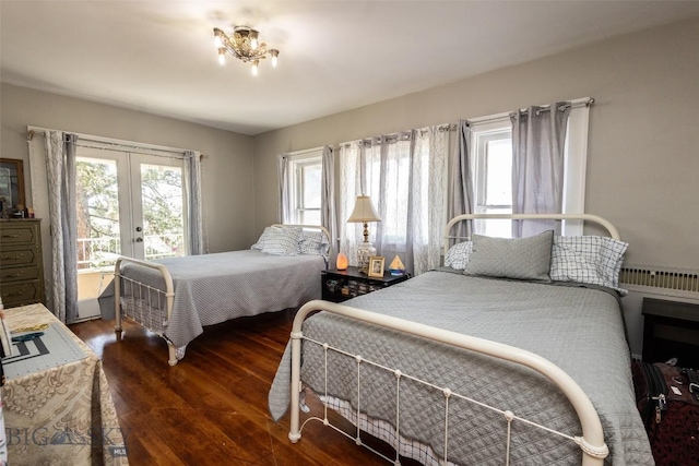 300 Holmes, Butte, MT 59701 - bedroom with french doors, wood finished floors, multiple windows, and access to exterior