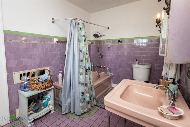 300 Holmes, Butte, MT 59701 - full bath featuring tile walls, tile patterned floors, shower / bath combo with shower curtain, and wainscoting